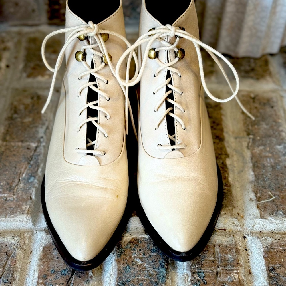 Size 6.5 Women’s cream colored booties INTENTIONALLY BLANK brand.